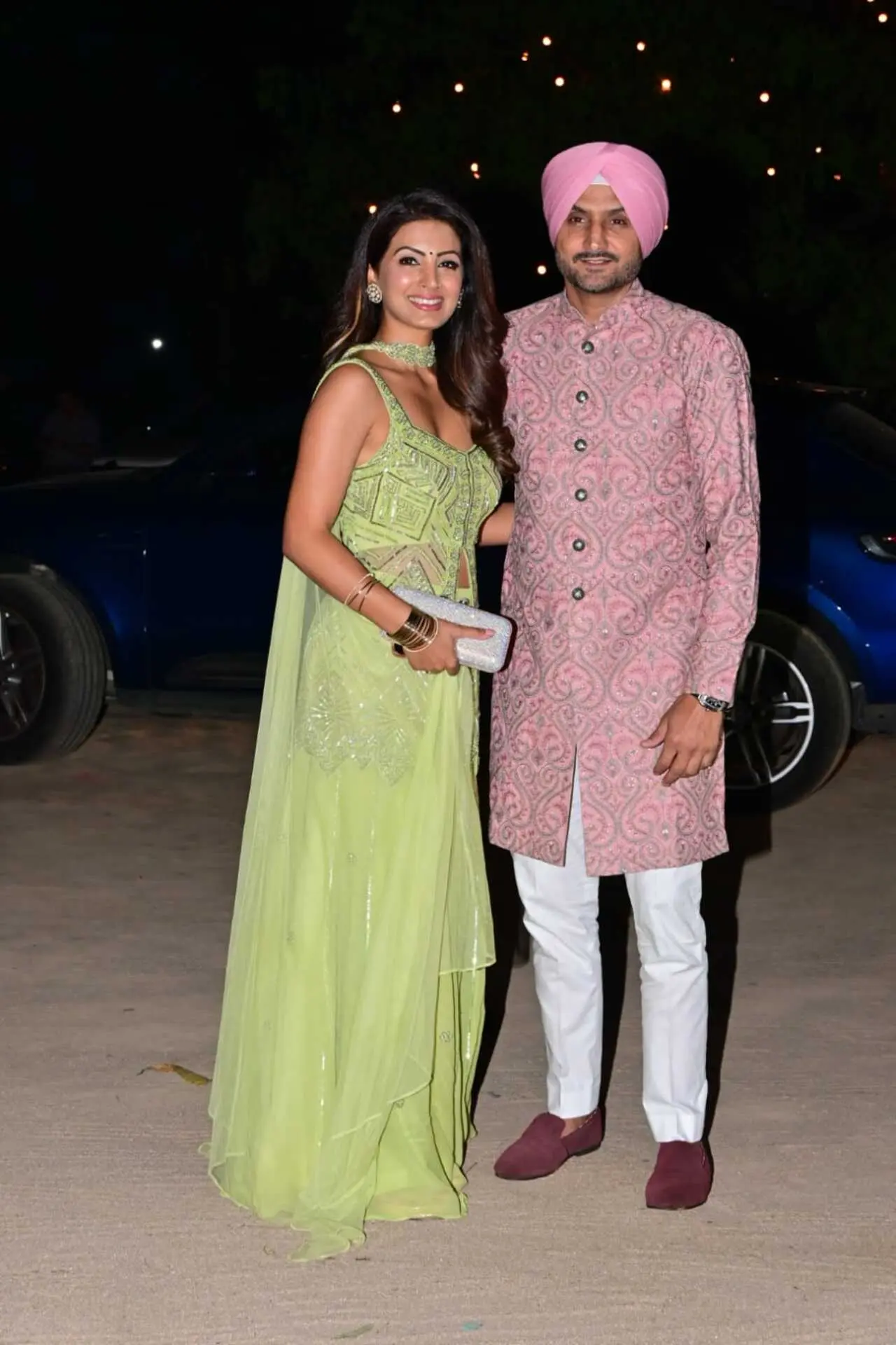 Harbhajan Singh and Geeta Basra looked picture-perfect at the celebration. Harbhajan wore a pastel pink embroidered sherwani with a matching turban and white trousers, while Geeta dazzled in a lime green embellished dress.